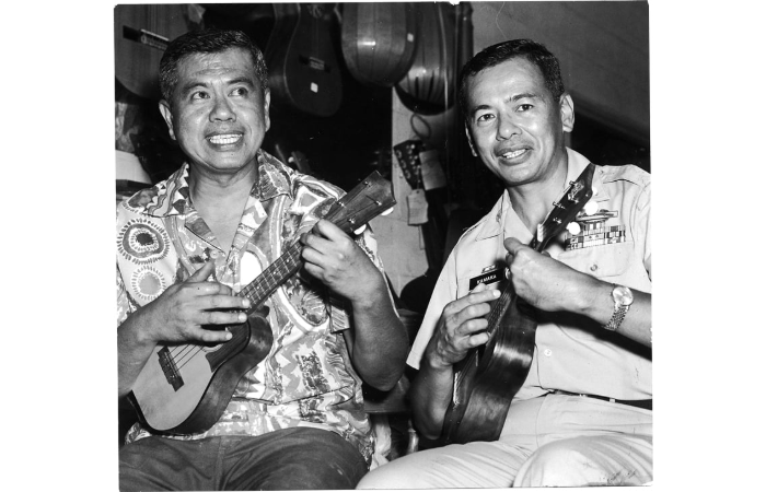 Young Sam Jr. and Fred Sr. playing ‘ukulele